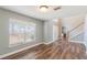 Bright living room with hardwood floors, neutral paint, and a view of the entryway at 12620 Bay Breeze Ct, Clermont, FL 34711