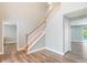 Elegant staircase with wood and white finishes, leading to the upper level of the home at 12620 Bay Breeze Ct, Clermont, FL 34711