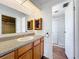 Bathroom featuring single sink vanity and a walk in shower with a glass door at 1312 Apache Cir, Tavares, FL 32778