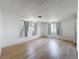 A bedroom with laminate floors, two windows and simple decor. A blank canvas to design your own space at 1312 Apache Cir, Tavares, FL 32778