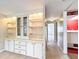 Hallway featuring built-in shelves and storage cabinets at 1312 Apache Cir, Tavares, FL 32778