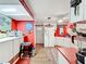 Quirky kitchen featuring red accents, ample counter space, and modern appliances at 1312 Apache Cir, Tavares, FL 32778