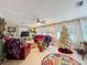 Cozy living room with a Christmas tree, plush seating, and ample natural light at 1312 Apache Cir, Tavares, FL 32778