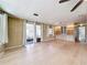Sun-filled living area with hardwood floors, ceiling fan, and lots of natural light at 1312 Apache Cir, Tavares, FL 32778