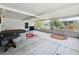 Spacious screened patio with hot tub, offering an inviting outdoor living area to enjoy the surroundings at 1312 Apache Cir, Tavares, FL 32778