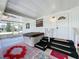Cozy covered patio featuring a hot tub and a welcoming entrance, perfect for relaxation and entertaining at 1312 Apache Cir, Tavares, FL 32778