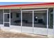 Enclosed screened porch, perfect for relaxing and enjoying the outdoors at 1312 Apache Cir, Tavares, FL 32778