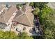 A high angle aerial view of a home, showing the backyard brick patio at 1502 Aalto Pl, The Villages, FL 32159