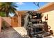 The paver driveway showcases access to the garage with a golf cart parked out front at 1502 Aalto Pl, The Villages, FL 32159