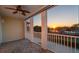 An outdoor screened lanai with ceiling fan offers stunning sunset water views at 164 Nautica Mile Dr, Clermont, FL 34711