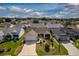 Aerial view of a lovely single-Gathering home with a well-manicured lawn and inviting curb appeal at 16721 Se 77Th Northridge Ct, The Villages, FL 32162