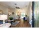 Inviting entryway with views of the open-concept living and dining areas featuring modern light fixtures at 16721 Se 77Th Northridge Ct, The Villages, FL 32162
