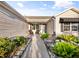 Charming front porch features beautiful landscaping, seating, and decorative accents, creating a welcoming entrance at 16721 Se 77Th Northridge Ct, The Villages, FL 32162