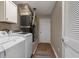 Laundry room featuring washer, dryer, overhead cabinet and a light colored floor at 16721 Se 77Th Northridge Ct, The Villages, FL 32162