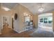 Charming living space with bar seating, stylish light fixtures, and views into other living spaces at 16721 Se 77Th Northridge Ct, The Villages, FL 32162