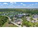 Aerial view showcasing the community's amenities, including a pool, playground, and scenic pond at 17024 Goldcrest Loop, Clermont, FL 34714