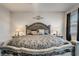 Well-lit bedroom featuring an ornate headboard and lots of pillows at 17024 Goldcrest Loop, Clermont, FL 34714