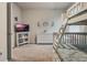 Bright bedroom featuring bunk beds, playful decor, and ample space for play, creating a fun and inviting environment at 17024 Goldcrest Loop, Clermont, FL 34714