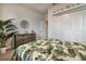 Neutral bedroom featuring a comfortable bed and stylish decor with a closet for a serene atmosphere at 17024 Goldcrest Loop, Clermont, FL 34714