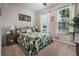 Relaxing bedroom featuring a comfortable bed, natural light from windows, and stylish decor for a serene atmosphere at 17024 Goldcrest Loop, Clermont, FL 34714