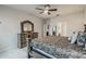 Cozy bedroom features ornate furnishings and mirrors on the door and dresser for a unique touch at 17024 Goldcrest Loop, Clermont, FL 34714