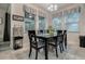 Dining room features a black dining set and lots of natural light at 17024 Goldcrest Loop, Clermont, FL 34714