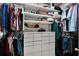 Organized walk-in closet featuring custom shelving, drawers, and ample hanging space for clothes and accessories at 17024 Goldcrest Loop, Clermont, FL 34714