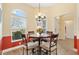 Sunny breakfast nook featuring a round table and large windows with natural light at 1797 Pamplico Ct, The Villages, FL 32162