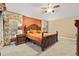 Bedroom featuring a large decorative wood bed frame, and decorative lamps at 1797 Pamplico Ct, The Villages, FL 32162