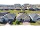 Aerial view of home in suburban neighborhood at 203 Silver Maple Rd, Groveland, FL 34736