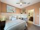 Cozy bedroom with workspace, carpeted floors, closet space, and ensuite access at 203 Silver Maple Rd, Groveland, FL 34736