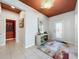 Bright foyer with stylish decor, a decorative ceiling, and tiled flooring leading to other rooms at 203 Silver Maple Rd, Groveland, FL 34736