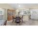 Dining area next to the kitchen features a built-in china cabinet and entry to the laundry room at 2068 Darlington Dr, The Villages, FL 32162