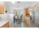 The kitchen eating area features a white table and windows that provide ample natural light at 2068 Darlington Dr, The Villages, FL 32162