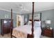 Bedroom with a four poster bed and en-suite bathroom and closet at 2068 Darlington Dr, The Villages, FL 32162