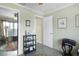 Hallway leading into home office featuring a printer, and computer at 2068 Darlington Dr, The Villages, FL 32162