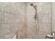 Walk-in shower with ceramic tiles and a showerhead at 2068 Darlington Dr, The Villages, FL 32162