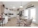 Dining area featuring tile flooring, a ceiling fan, and access to an outdoor area at 20751 Queen Alexandra Dr, Leesburg, FL 34748