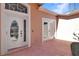 Front entrance featuring a leaded glass door and double french doors to the side at 20751 Queen Alexandra Dr, Leesburg, FL 34748