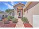 Front entrance features a decorative front door, and neatly maintained landscaping at 20751 Queen Alexandra Dr, Leesburg, FL 34748