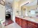Bright bathroom with double sink vanity, with access to the soaking tub at 27023 Old English Ct, Leesburg, FL 34748