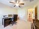 Home office bedroom featuring a ceiling fan and closet at 27023 Old English Ct, Leesburg, FL 34748