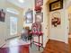 Charming entryway with tile and wood floors, a decorative glass front door, and elegant furnishings at 27023 Old English Ct, Leesburg, FL 34748