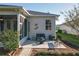 Rear exterior of home with an outdoor patio and screened-in porch for entertaining guests at 27023 Old English Ct, Leesburg, FL 34748