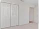 Bedroom featuring neutral carpet and large closet space at 2712 Benavides Dr, The Villages, FL 32162