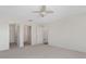 Spacious bedroom with ceiling fan and many doors at 2712 Benavides Dr, The Villages, FL 32162