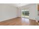 Bright dining room with wood floors and sliding glass doors to a patio at 2712 Benavides Dr, The Villages, FL 32162