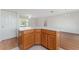 View of kitchen island with lots of space, wood cabinets, and white countertop at 2712 Benavides Dr, The Villages, FL 32162