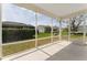 Enjoy the outdoors from this screened-in lanai with views of the lush landscaping and neighborhood at 2712 Benavides Dr, The Villages, FL 32162