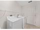 Convenient laundry room with washer, dryer, and ample storage space for all your needs at 2712 Benavides Dr, The Villages, FL 32162